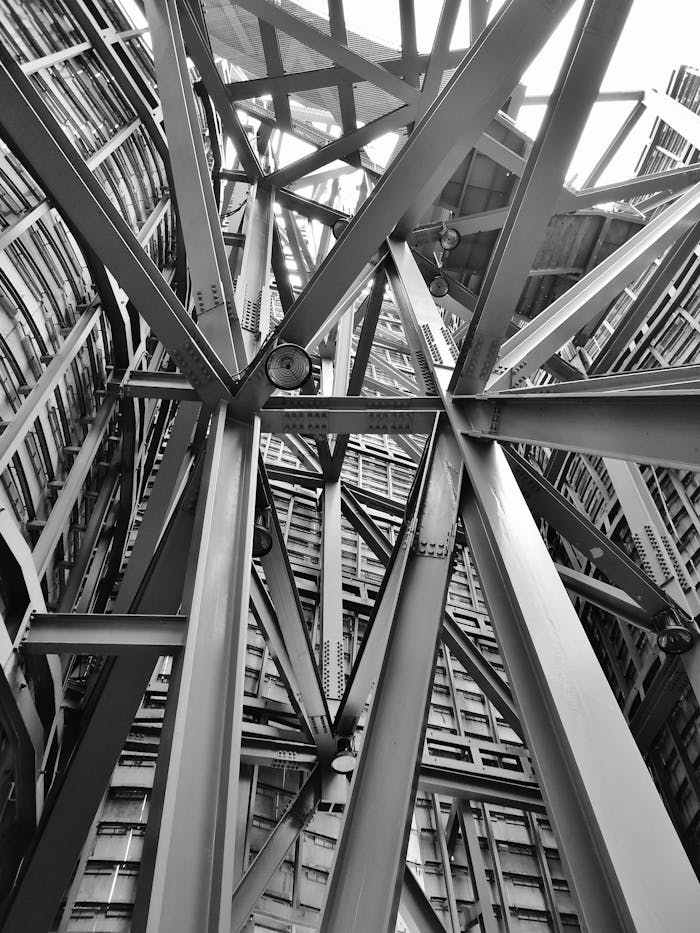 about-us-01 A detailed view of a complex steel framework showcasing modern industrial architecture.